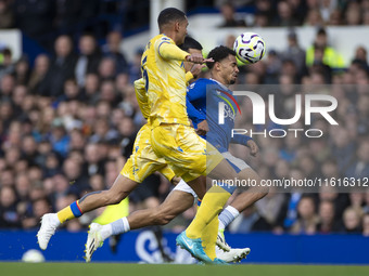 Iliman Ndiaye #10 of Everton F.C. is tackled by the opponent during the Premier League match between Everton and Crystal Palace at Goodison...