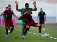 In Ta' Qali, Malta, on September 27, 2024, Thiago Espindola de Paula of Gzira United is challenged from the back by Kemar Reid of Floriana d...