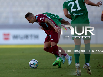 Thiago Espindola de Paula (L) of Gzira United is in action during the Malta 360 Sports Premier League soccer match between Floriana and Gzir...