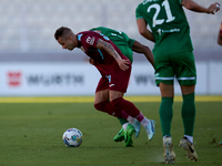 Thiago Espindola de Paula (L) of Gzira United is in action during the Malta 360 Sports Premier League soccer match between Floriana and Gzir...