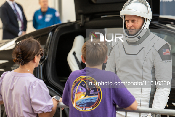 Nick Hague talks with his family minutes before heading to launch pad 40 at the Cape Canaveral Space Force Station. 