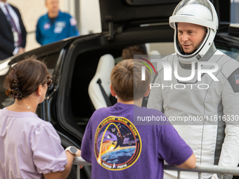 Nick Hague talks with his family minutes before heading to launch pad 40 at the Cape Canaveral Space Force Station. (