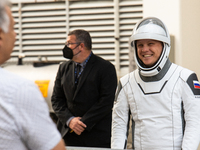 Cosmonaut Alexander Gorbunov from Russia talks with his family before heading to the launch pad 40 at the Cape Canaveral Space Force Station...