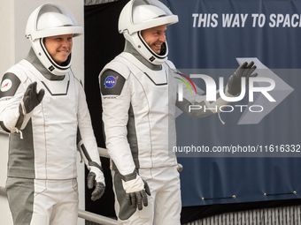 Astronaut Nick Hague (NASA), right, and Cosmonaut Alexander Gorbunov (Roscosmos), left, during the traditional ''walkout,'' leave the Astron...