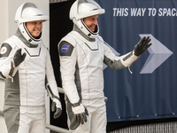 Astronaut Nick Hague (NASA), right, and Cosmonaut Alexander Gorbunov (Roscosmos), left, during the traditional ''walkout,'' leave the Astron...