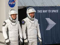 Astronaut Nick Hague (NASA), right, and Cosmonaut Alexander Gorbunov (Roscosmos), left, during the traditional ''walkout,'' leave the Astron...