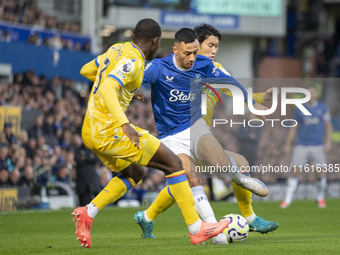 Dwight McNeil #7 of Everton F.C. is tackled by Tyrick Mitchell #3 of Crystal Palace F.C. during the Premier League match between Everton and...