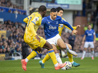 Dwight McNeil #7 of Everton F.C. is tackled by Tyrick Mitchell #3 of Crystal Palace F.C. during the Premier League match between Everton and...