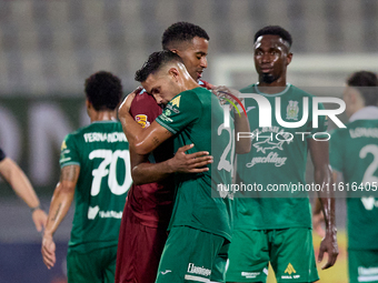 Thaylor Aldama of Gzira United and Nicolas Marias Garcia of Floriana hug each other after the Malta 360 Sports Premier League soccer match b...