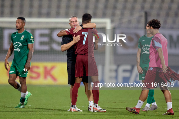 Darren Abdilla, head coach of Floriana, hugs Thaylor Aldama of Gzira United after the Malta 360 Sports Premier League soccer match between F...