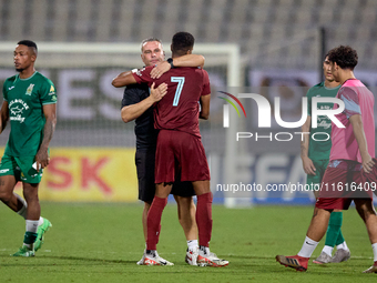 Darren Abdilla, head coach of Floriana, hugs Thaylor Aldama of Gzira United after the Malta 360 Sports Premier League soccer match between F...