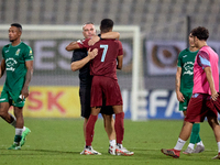 Darren Abdilla, head coach of Floriana, hugs Thaylor Aldama of Gzira United after the Malta 360 Sports Premier League soccer match between F...