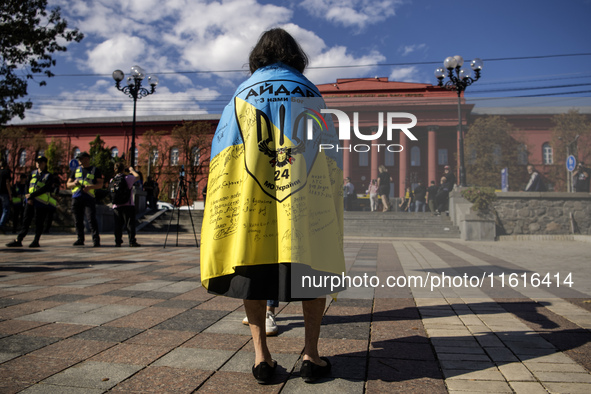 Ukrainians attend a march marking the upcoming Defenders of Ukraine Day in Kyiv, Ukraine, on September 28, 2024 