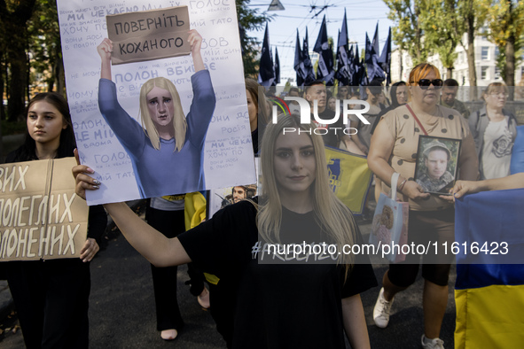 Ukrainians attend a march marking the upcoming Defenders of Ukraine Day in Kyiv, Ukraine, on September 28, 2024 