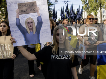 Ukrainians attend a march marking the upcoming Defenders of Ukraine Day in Kyiv, Ukraine, on September 28, 2024 (