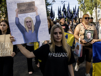 Ukrainians attend a march marking the upcoming Defenders of Ukraine Day in Kyiv, Ukraine, on September 28, 2024 (