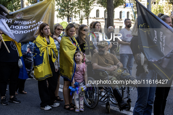 Ukrainians attend a march marking the upcoming Defenders of Ukraine Day in Kyiv, Ukraine, on September 28, 2024 