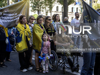 Ukrainians attend a march marking the upcoming Defenders of Ukraine Day in Kyiv, Ukraine, on September 28, 2024 (