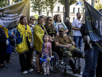 Ukrainians attend a march marking the upcoming Defenders of Ukraine Day in Kyiv, Ukraine, on September 28, 2024 (