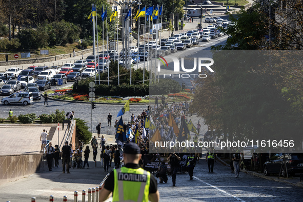 Ukrainians attend a march marking the upcoming Defenders of Ukraine Day in Kyiv, Ukraine, on September 28, 2024 