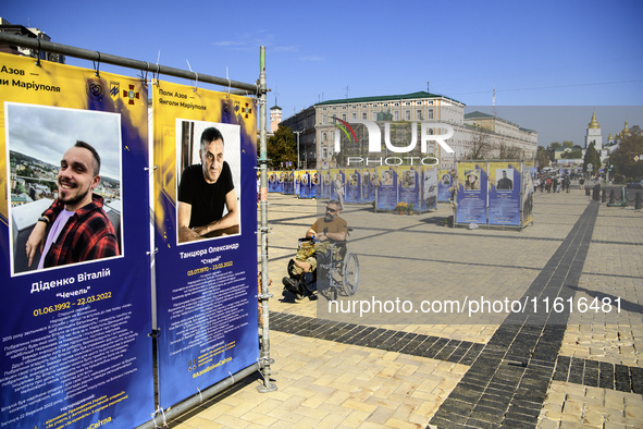 Portraits of Ukrainian soldiers who are killed fighting with the Azov brigade in Mariupol during a march marking the upcoming Defenders of U...