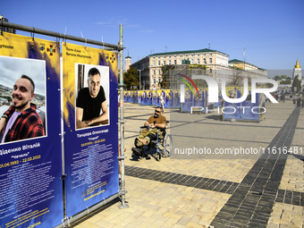 Portraits of Ukrainian soldiers who are killed fighting with the Azov brigade in Mariupol during a march marking the upcoming Defenders of U...