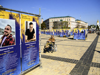 Portraits of Ukrainian soldiers who are killed fighting with the Azov brigade in Mariupol during a march marking the upcoming Defenders of U...