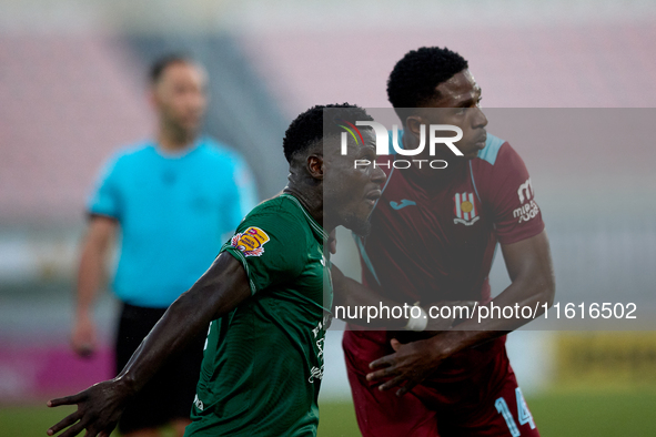 Frankin Sasere (front) of Floriana and Luis Carlos Riascos (back) grapple for position during the Malta 360 Sports Premier League soccer mat...