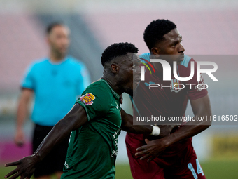 Frankin Sasere (front) of Floriana and Luis Carlos Riascos (back) grapple for position during the Malta 360 Sports Premier League soccer mat...