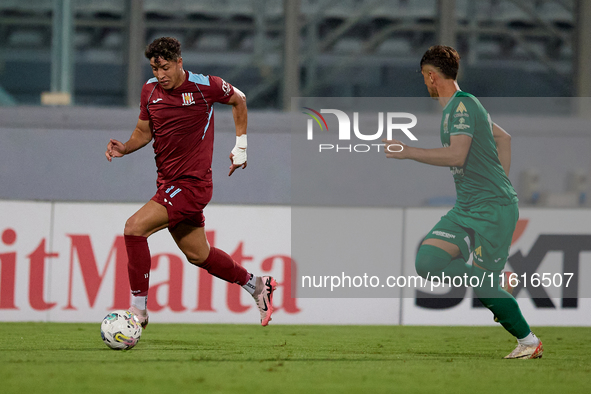 Chouaib Faysal (L) of Gzira United is in action during the Malta 360 Sports Premier League soccer match between Floriana and Gzira United at...