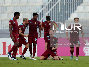 Gabriel Bohrer Mentz (second from right) of Gzira United reacts in celebration after scoring the 1-1 goal during the Malta 360 Sports Premie...