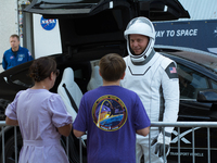 Astronaut Nick Hague speaks to his wife and son before being transported to the SpaceX Falcon 9 rocket that carries him to the ISS. (