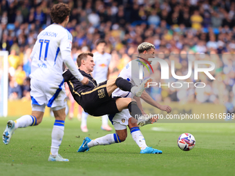 Ethan Ampadu (Leeds United) goes off injured after a challenge with Ben Sheaf (Coventry City) during the Sky Bet Championship match between...