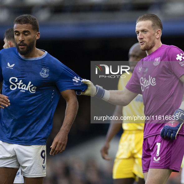 Jordan Pickford #1 (GK) of Everton F.C. and Dominic Calvert-Lewin #9 of Everton F.C. during the Premier League match between Everton and Cry...