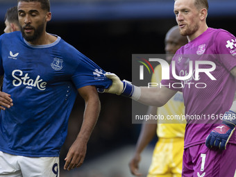 Jordan Pickford #1 (GK) of Everton F.C. and Dominic Calvert-Lewin #9 of Everton F.C. during the Premier League match between Everton and Cry...