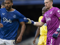 Jordan Pickford #1 (GK) of Everton F.C. and Dominic Calvert-Lewin #9 of Everton F.C. during the Premier League match between Everton and Cry...