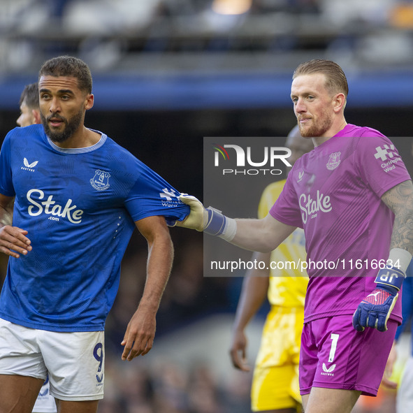 Jordan Pickford #1 (GK) of Everton F.C. and Dominic Calvert-Lewin #9 of Everton F.C. during the Premier League match between Everton and Cry...