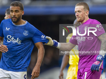 Jordan Pickford #1 (GK) of Everton F.C. and Dominic Calvert-Lewin #9 of Everton F.C. during the Premier League match between Everton and Cry...