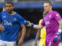 Jordan Pickford #1 (GK) of Everton F.C. and Dominic Calvert-Lewin #9 of Everton F.C. during the Premier League match between Everton and Cry...