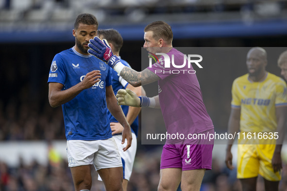 Jordan Pickford #1 (GK) of Everton F.C. and Dominic Calvert-Lewin #9 of Everton F.C. during the Premier League match between Everton and Cry...