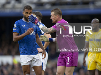 Jordan Pickford #1 (GK) of Everton F.C. and Dominic Calvert-Lewin #9 of Everton F.C. during the Premier League match between Everton and Cry...