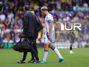 Ethan Ampadu (Leeds United) goes off injured after a challenge with Ben Sheaf (Coventry City) during the Sky Bet Championship match between...