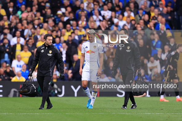 Ethan Ampadu (Leeds United) goes off injured after a challenge with Ben Sheaf (Coventry City) during the Sky Bet Championship match between...