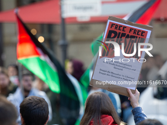 About a hundred pro-Palestinian protesters gather in Bonn, Germany, on September 28, 2024, and protest against Israel's attack in Lebanon, d...