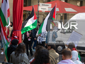 About a hundred pro-Palestinian protesters gather in Bonn, Germany, on September 28, 2024, and protest against Israel's attack in Lebanon, d...