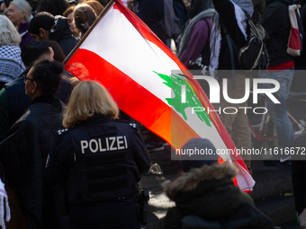 About a hundred pro-Palestinian protesters gather in Bonn, Germany, on September 28, 2024, and protest against Israel's attack in Lebanon, d...