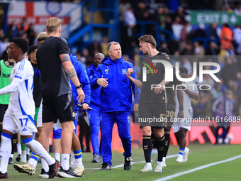 Mark Robbins, Coventry City manager, talks to Jack Rudoni (Coventry City) during the Sky Bet Championship match between Leeds United and Cov...