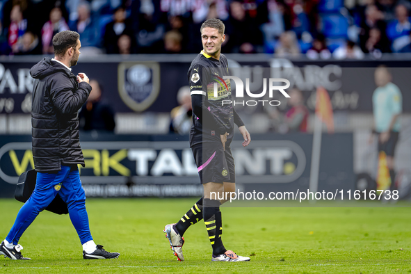 PSV Eindhoven midfielder Joey Veerman gets injured during the match between Willem II and PSV at the Koning Willem II stadium for the Dutch...