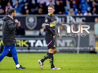 PSV Eindhoven midfielder Joey Veerman gets injured during the match between Willem II and PSV at the Koning Willem II stadium for the Dutch...