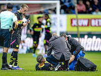 PSV Eindhoven midfielder Joey Veerman gets injured during the match between Willem II and PSV at the Koning Willem II stadium for the Dutch...